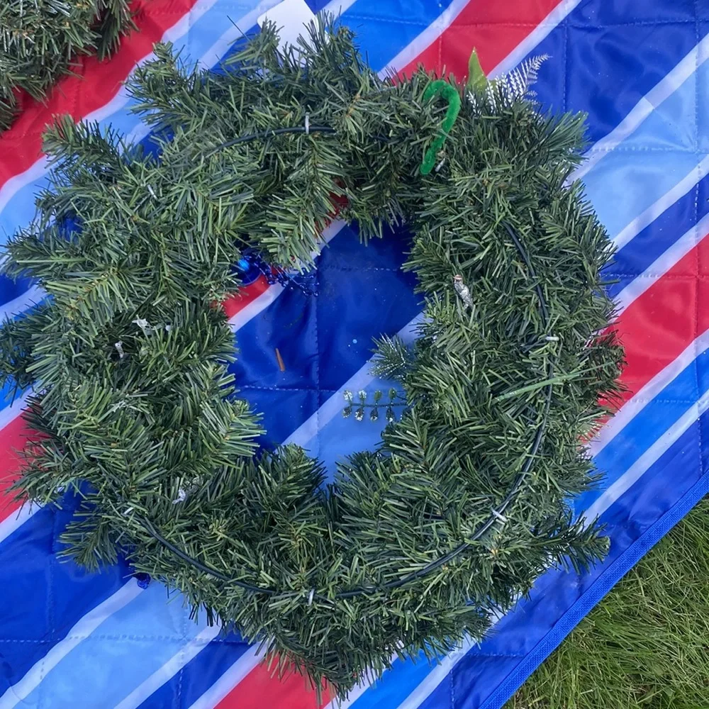 Evergreen Wreath Trimmed with silver and blue and pine ones